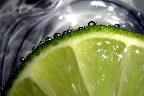 Not a recommendation, but gin commonly contains botanicals used in Chinese medicine. Gin and tonic.