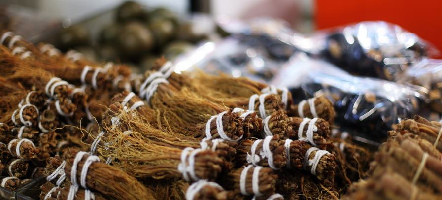 Chinese medicine includes herbs, in addition to acupuncture. Chinese herbs being sold at an outdoor market.